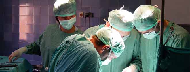 Four surgeons operating 