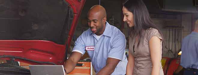 Car repair Mechanic helping a customer