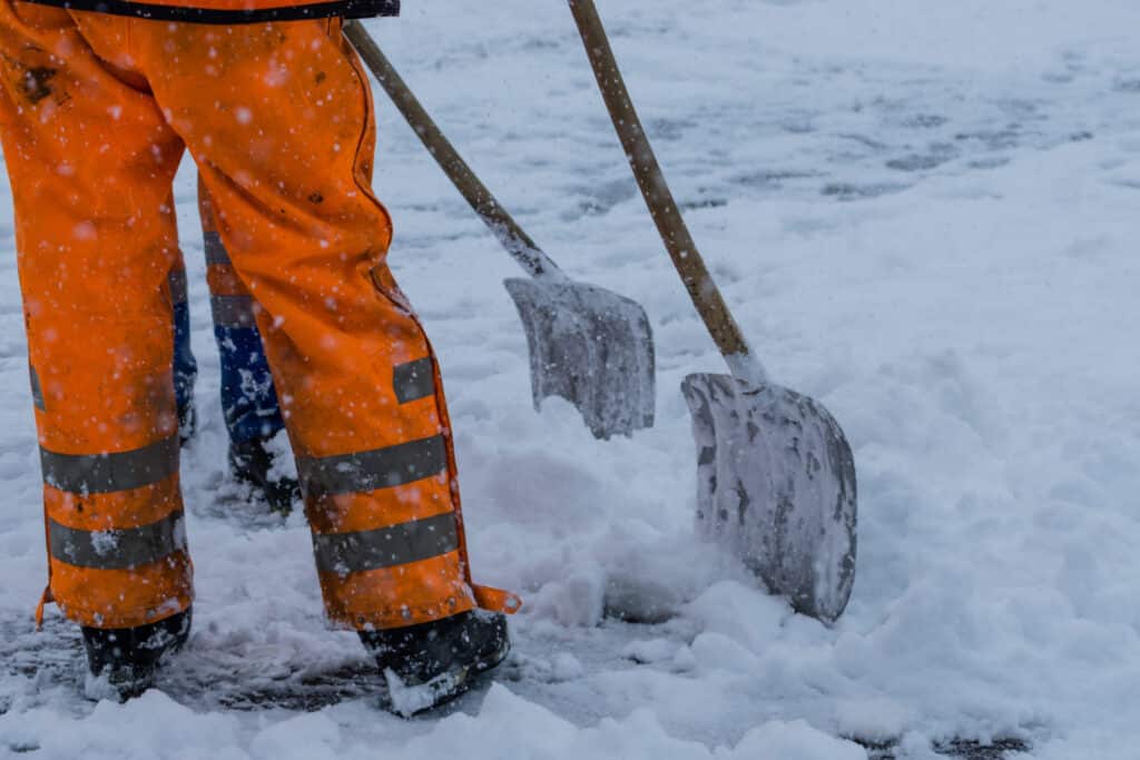 2 men shoveling snow