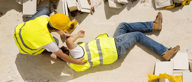 worker injured on the job being helped by another worker